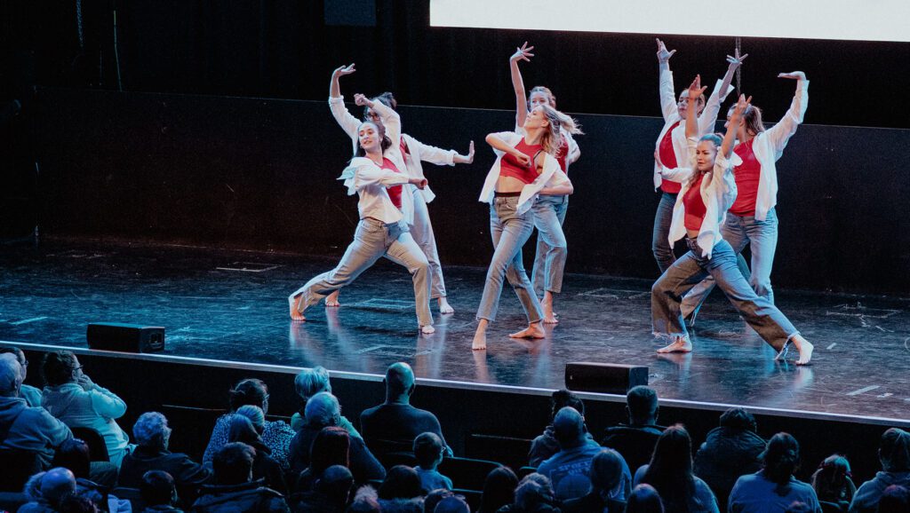 Edge Hill students perform on-stage at the Wigan Borough Dance Festival 2023.