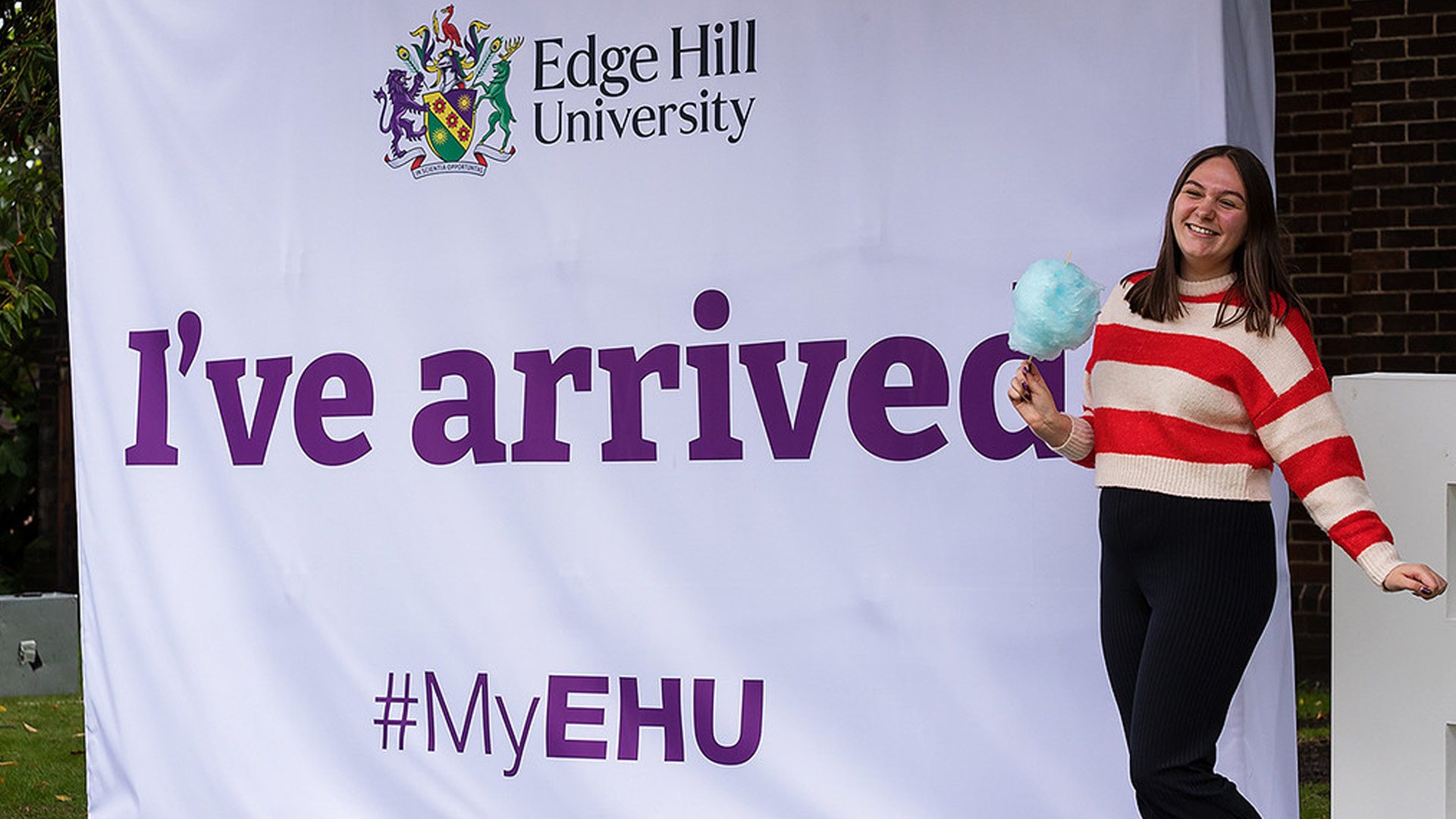 New student posing next to sign reading 'Ive Arrived' #MyEHU