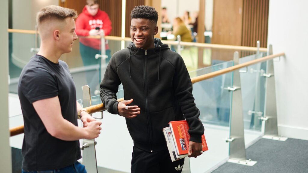 Students talking in Law & Psychology building.