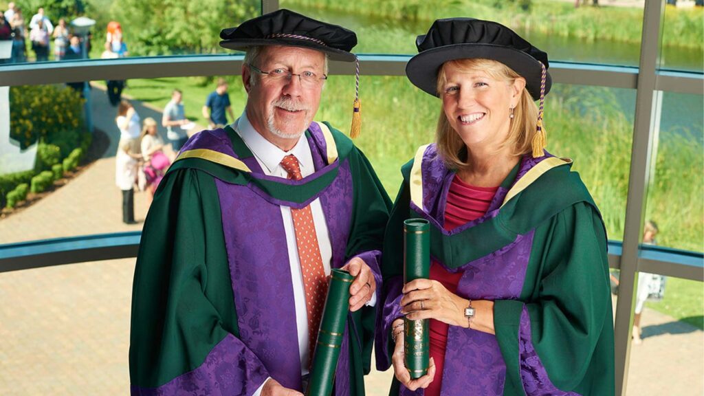 Colin Parry and Wendy Parry with their honorary doctorate awards