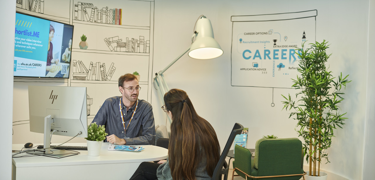 A student talks to a Careers advisor in Careers Corner