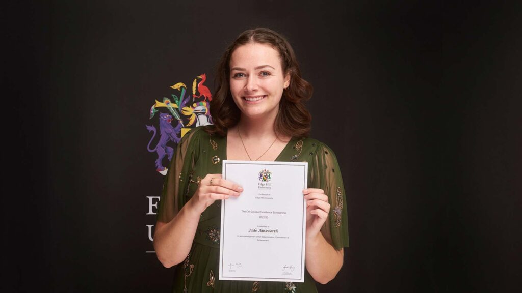 Jade Ainsworth holds a certificate at the Scholarship Awards 2022
