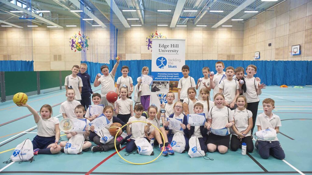Primary school students taking part in Tackling the Blues activities in Edge Hill Sport.