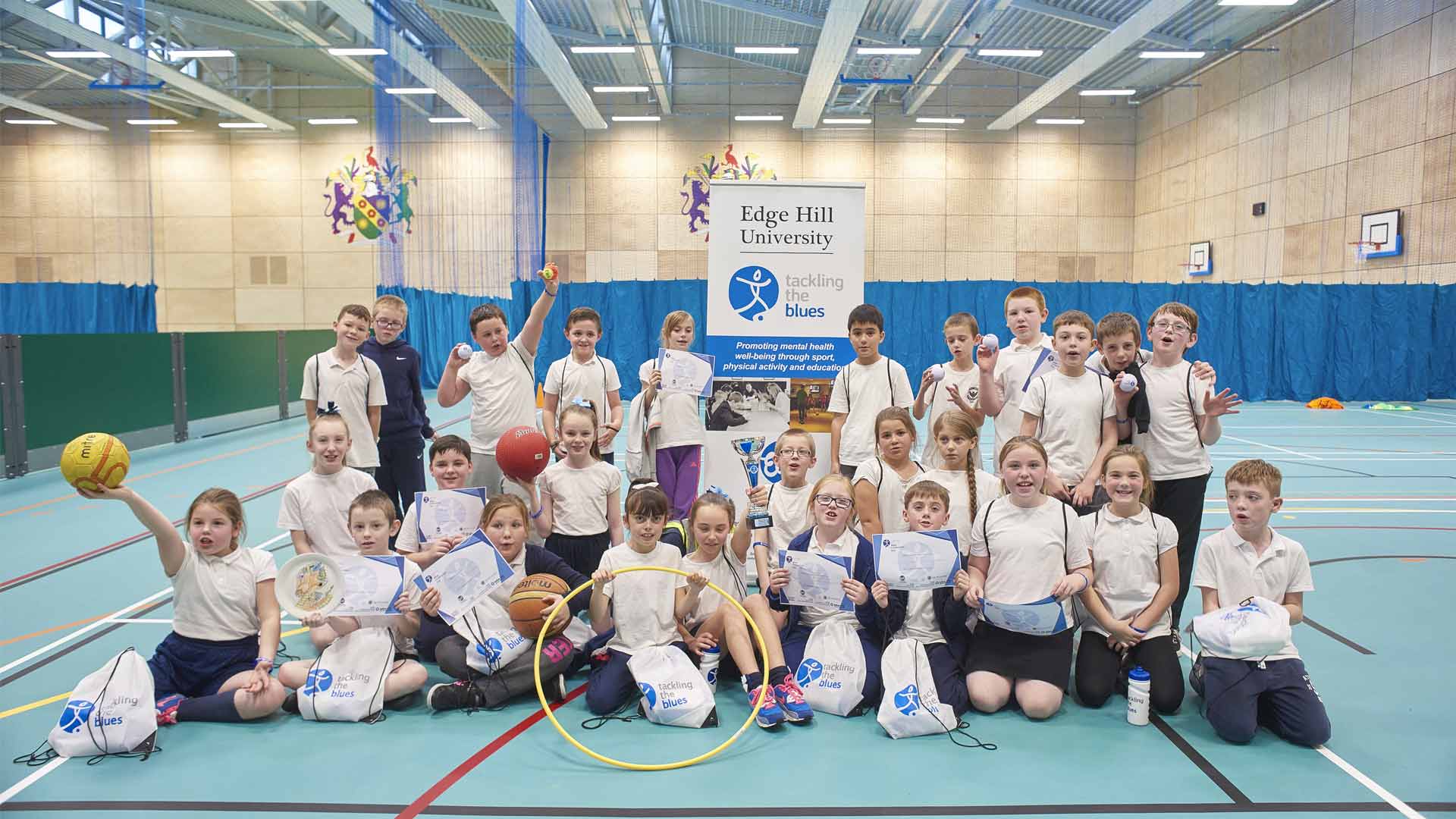 Primary school students taking part in Tackling the Blues activities in Edge Hill Sport.