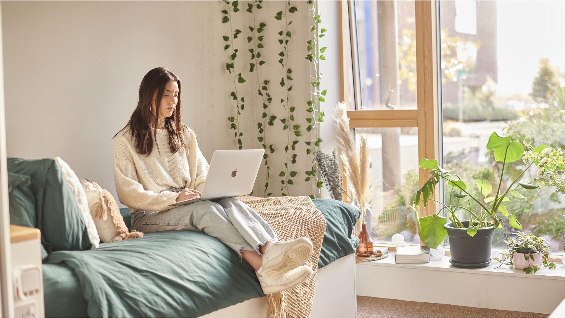 Student in halls on laptop