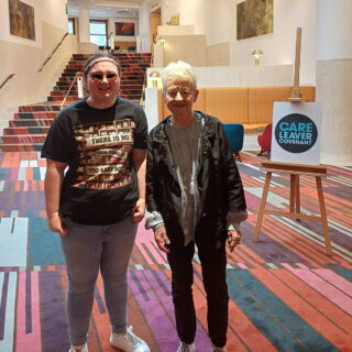 Student Caitlyn Fell, standing with Jacqueline Wilson at a writing workshop set up by the care leaver covenant