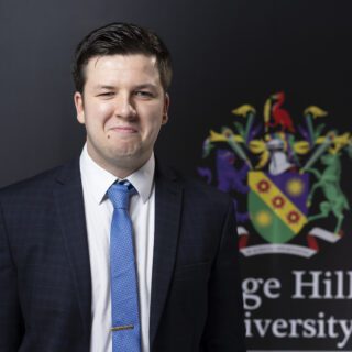 Edge Hill student dressed in a suit.