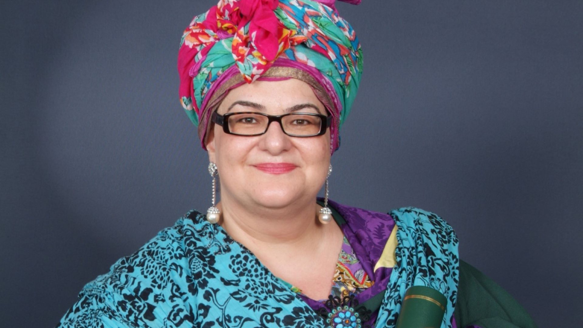 Camila Batmanghelidjh wears a colourful headress and an Edge Hill ceremonial gown.