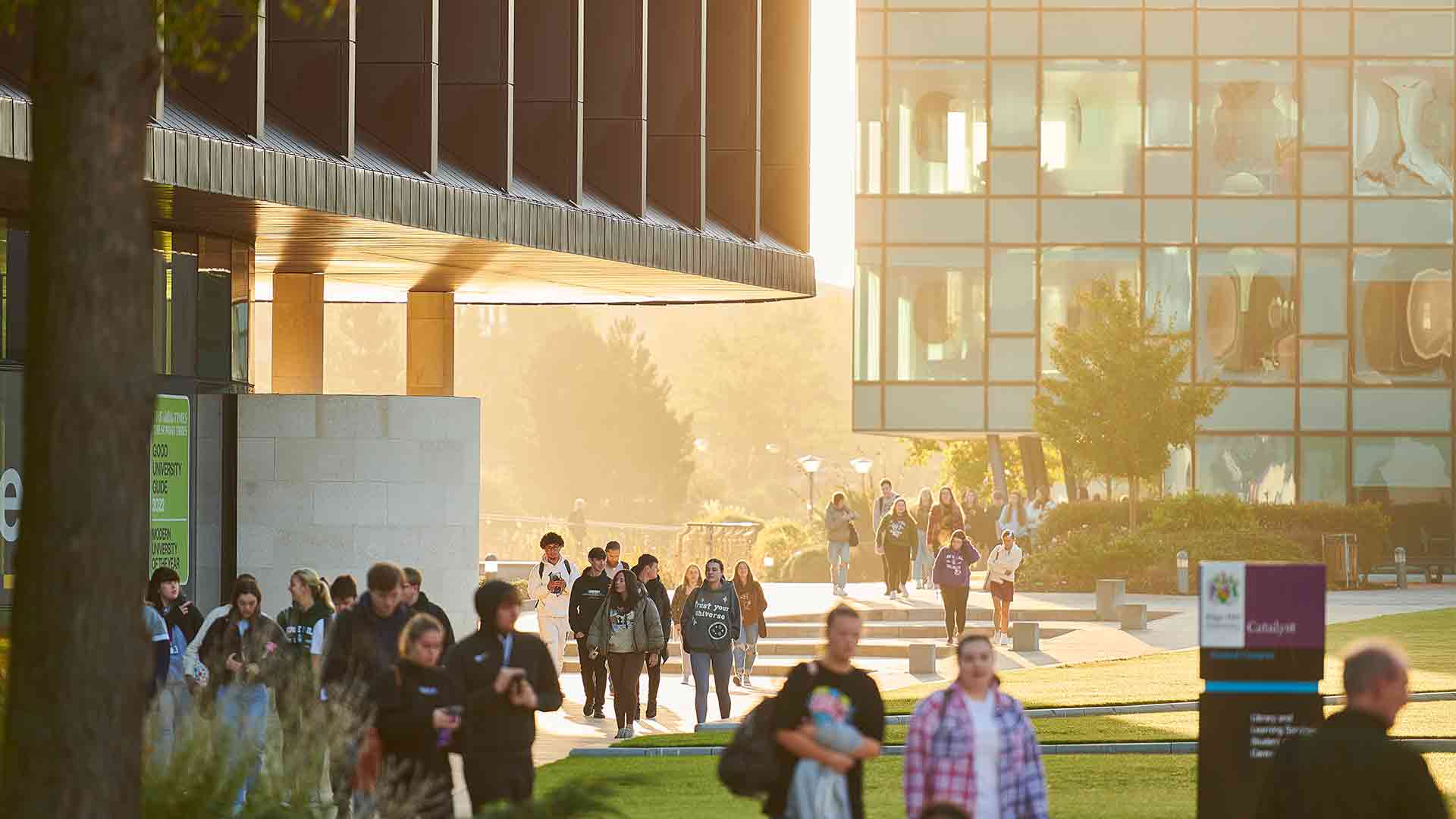 An exterior shot of the Catalyst, with students walking around.