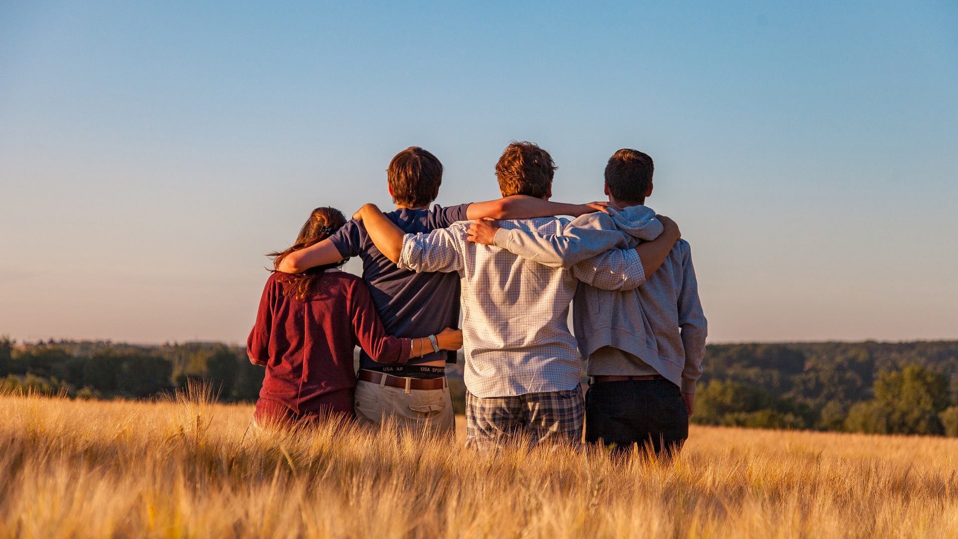 Friends linking arms.