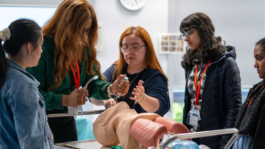Prospective students participate in a simulation during a Medical School taster session