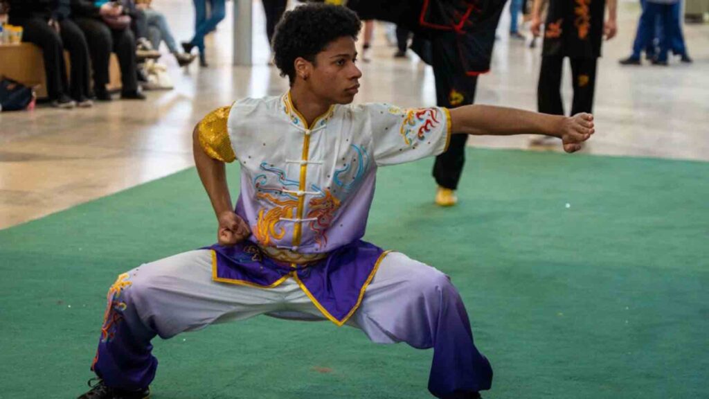 Chinese New Year event. Student showcasing dancing/karate skills.