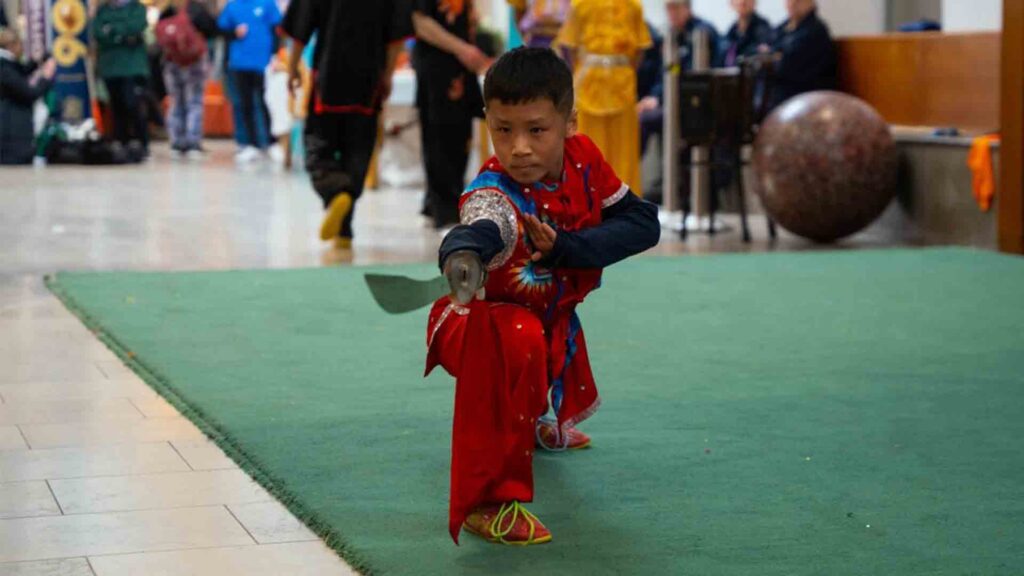 Chinese New Year event. Student taking part in martial arts with a sword.