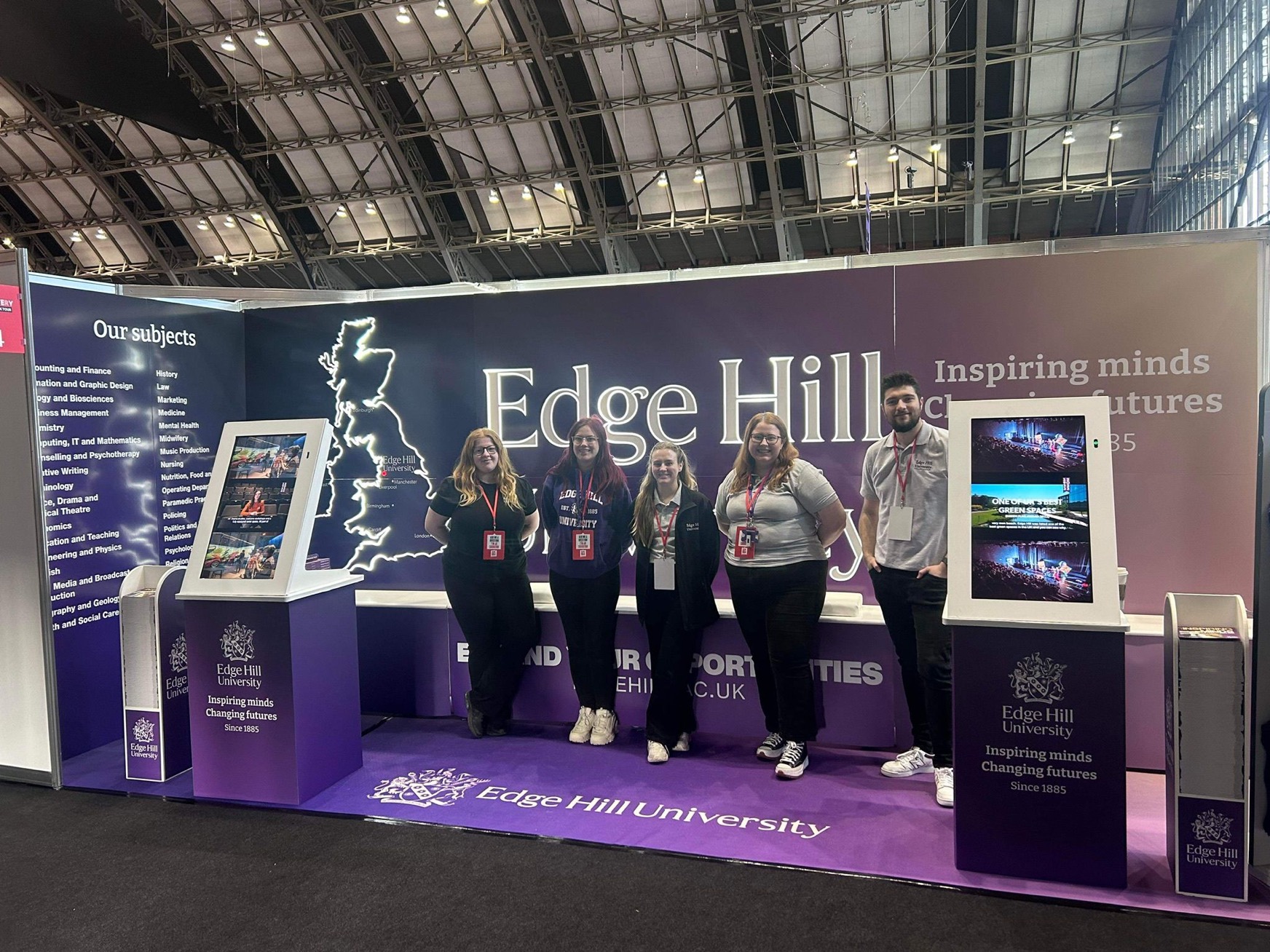 A group of Education Liaison staff at the Edge Hill stand at a UCAS Fair.