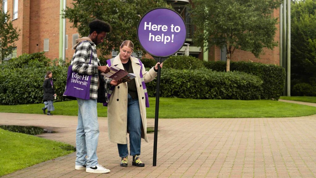 A Student Guide directs a prospective student at an Edge Hill Open Day