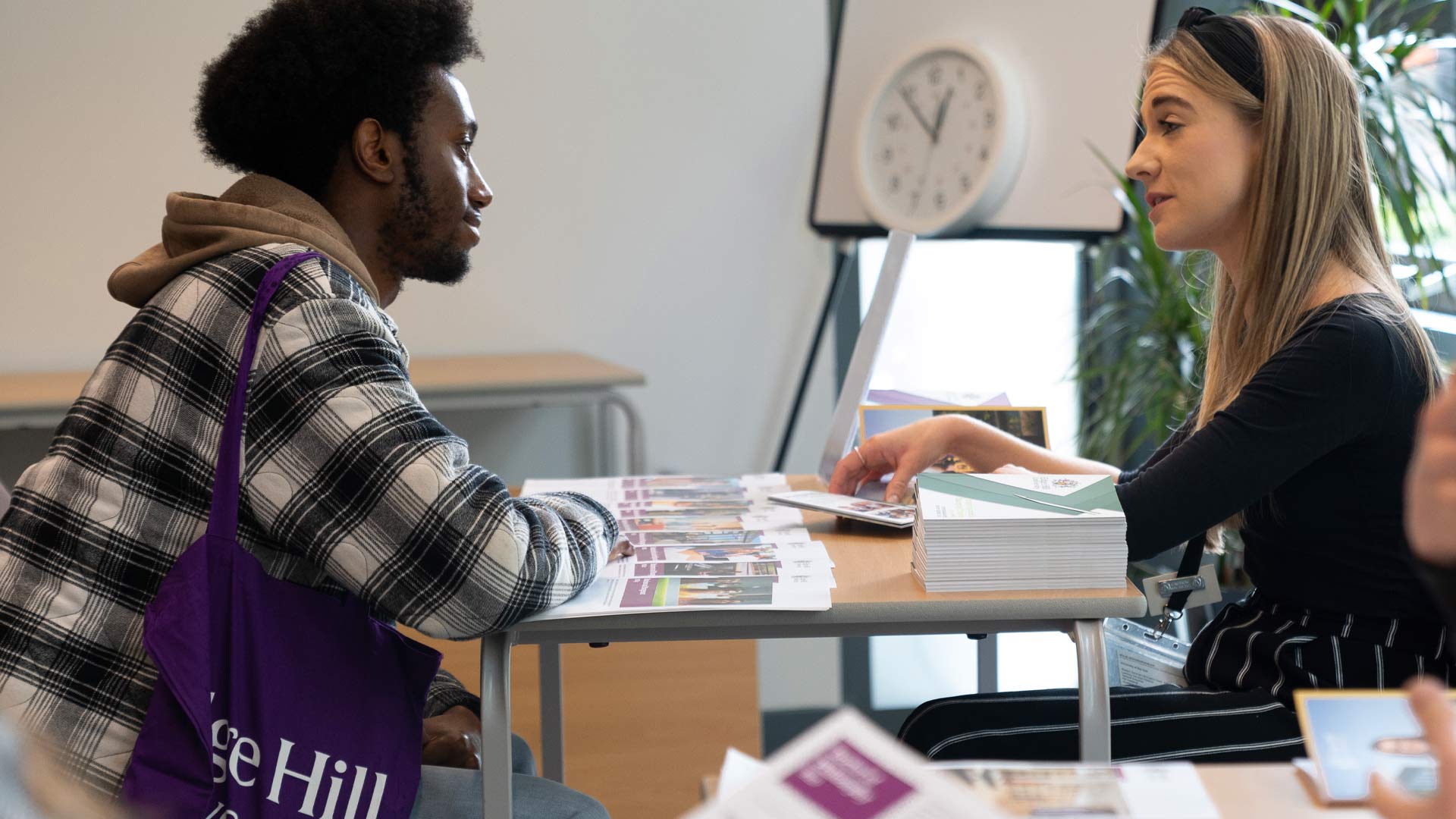 A prospective undergraduate student and a member of staff during an open day one-to-one session