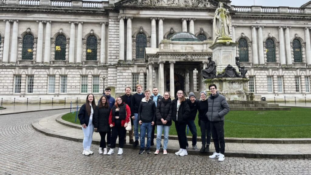 students and staff outside City Hall cover photo