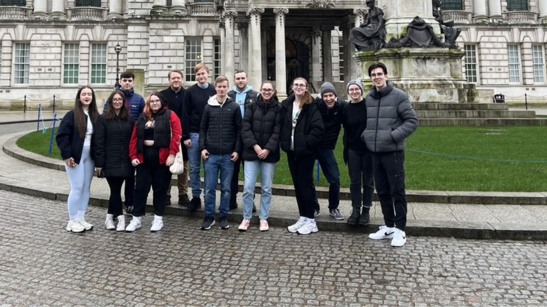 students and staff outside City Hall cover photo