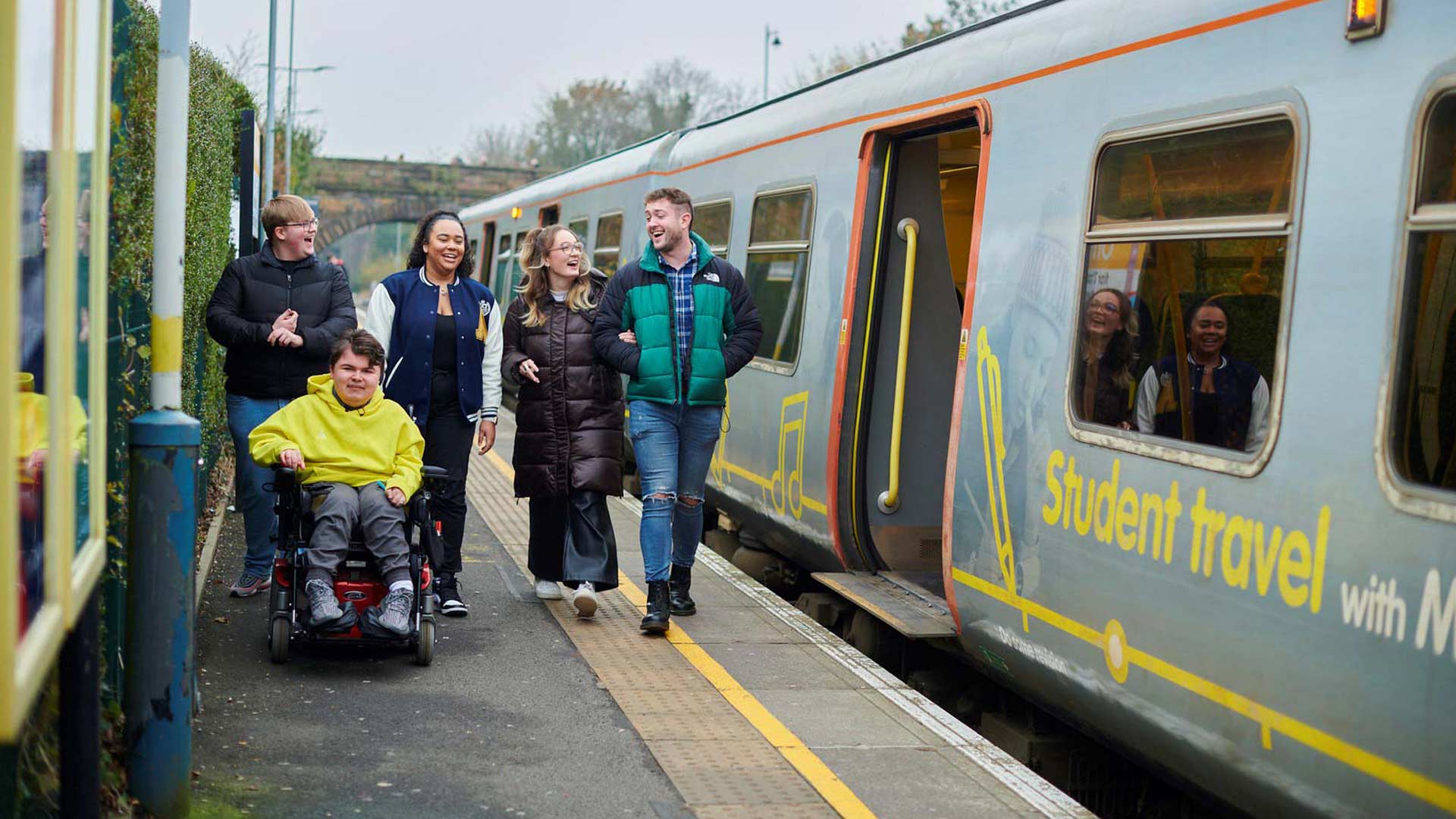 students at a train station