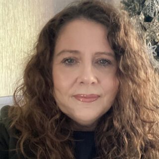 A headshot of Laurie Davies