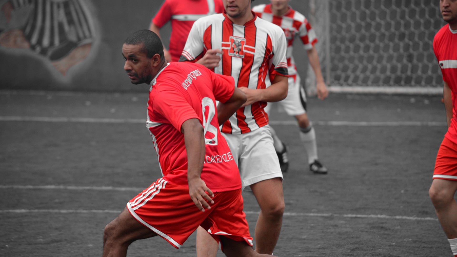 Players in an ongoing sports match.