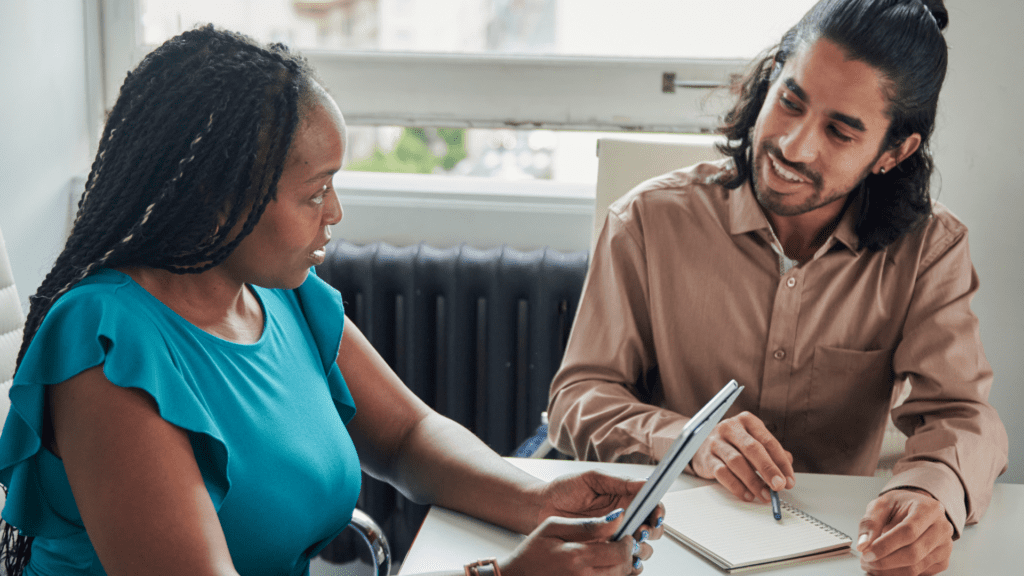 Two people working together.