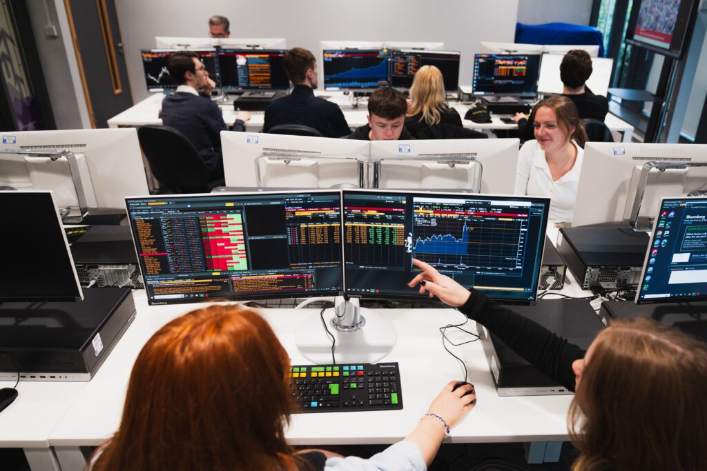 Students in the Bloomberg Suite looking at computer screens.