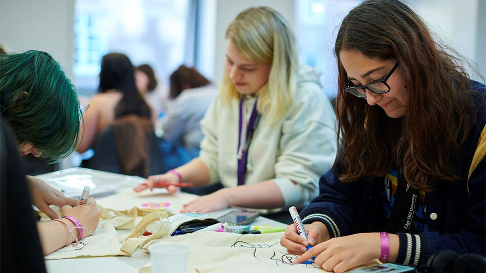 group of students doing crafts in a seminar room