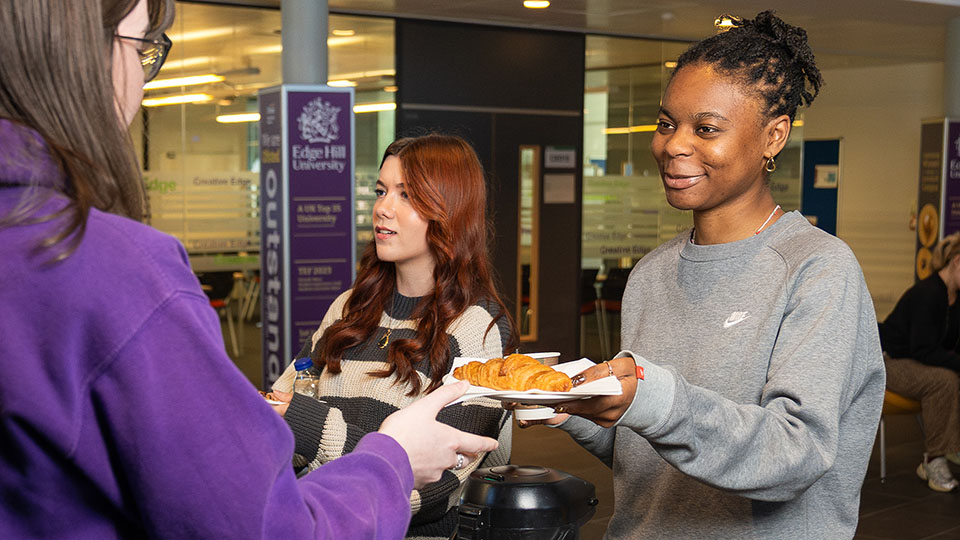 students getting their free commuter breakfast from creative edge