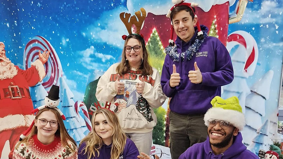 students asmiling while attending edge hill christmas markets
