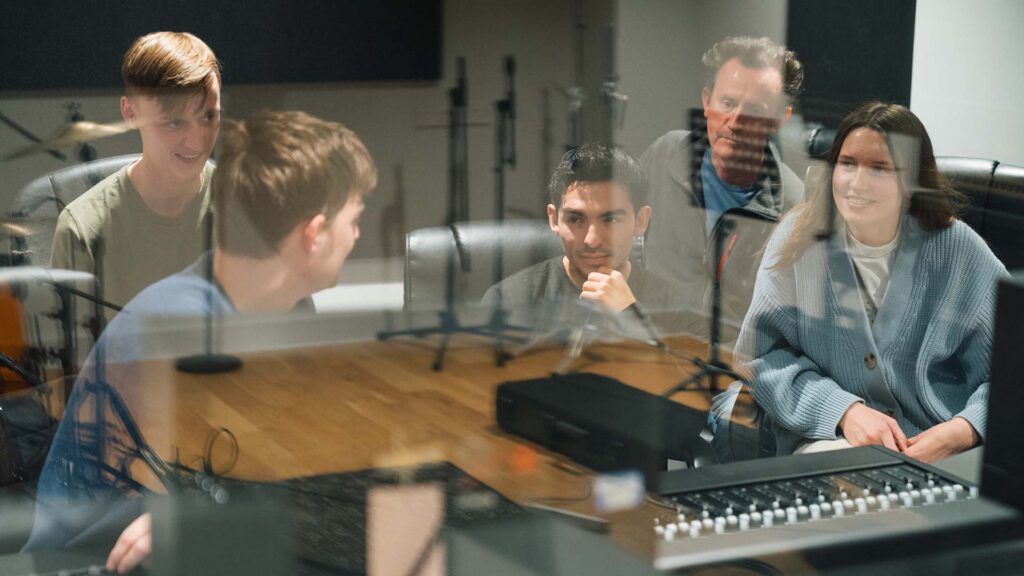 Producer Matt Taylor in the studio, showing Edge Hill students the ropes.