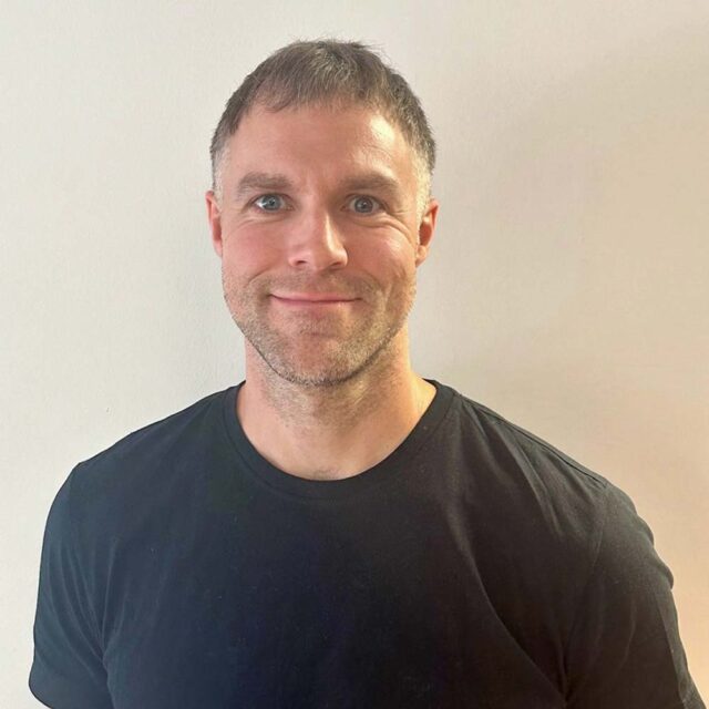 A headshot of Stephen Phillips