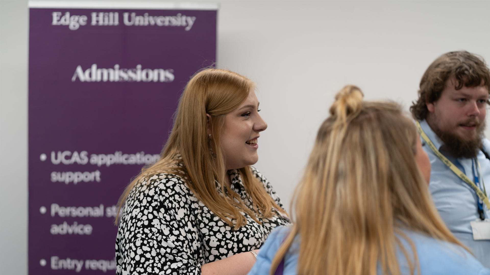 Staff member speaking to student