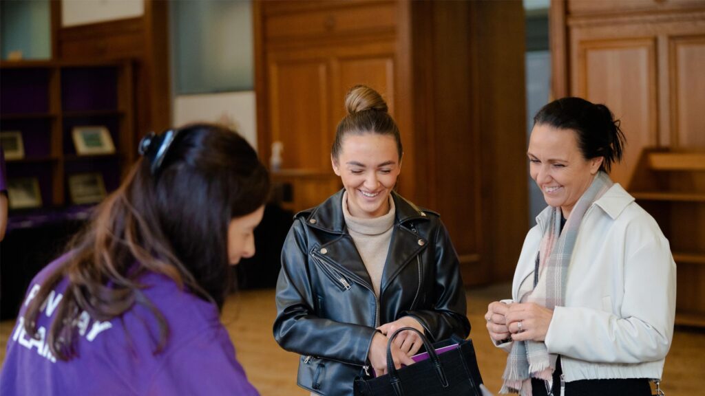 Prospective student and their parent/supporter checking in for an Edge Hill open day