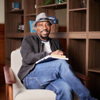 Counselling student sat on a chair