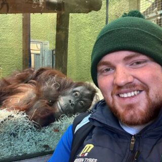 Photo of Oisin Mag Uidhir with orangutan at Blackpool Zoo
