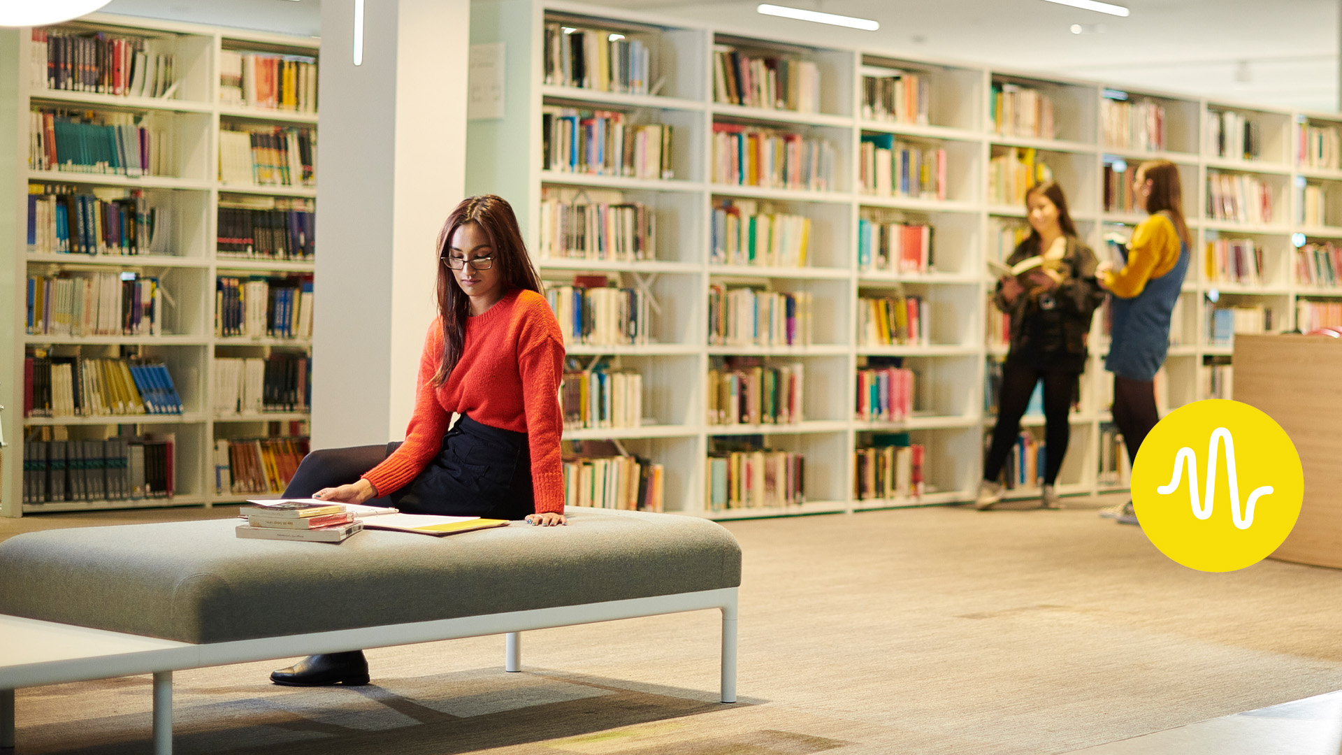 interior of Catalyst showing three students using the library facilities.
