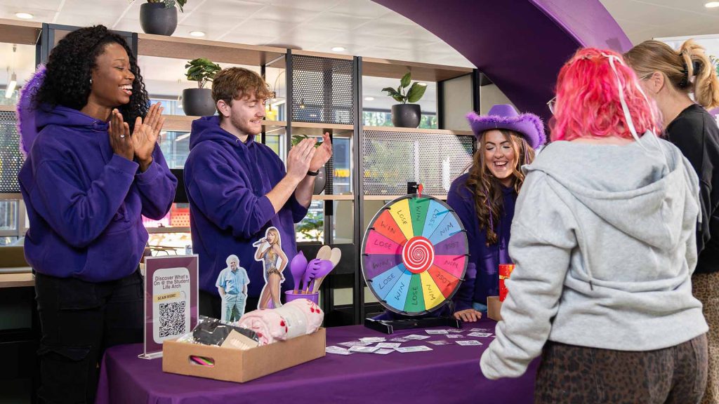 students at the student life arch with campus connectors