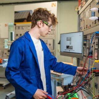Engineering student in an electrical lab