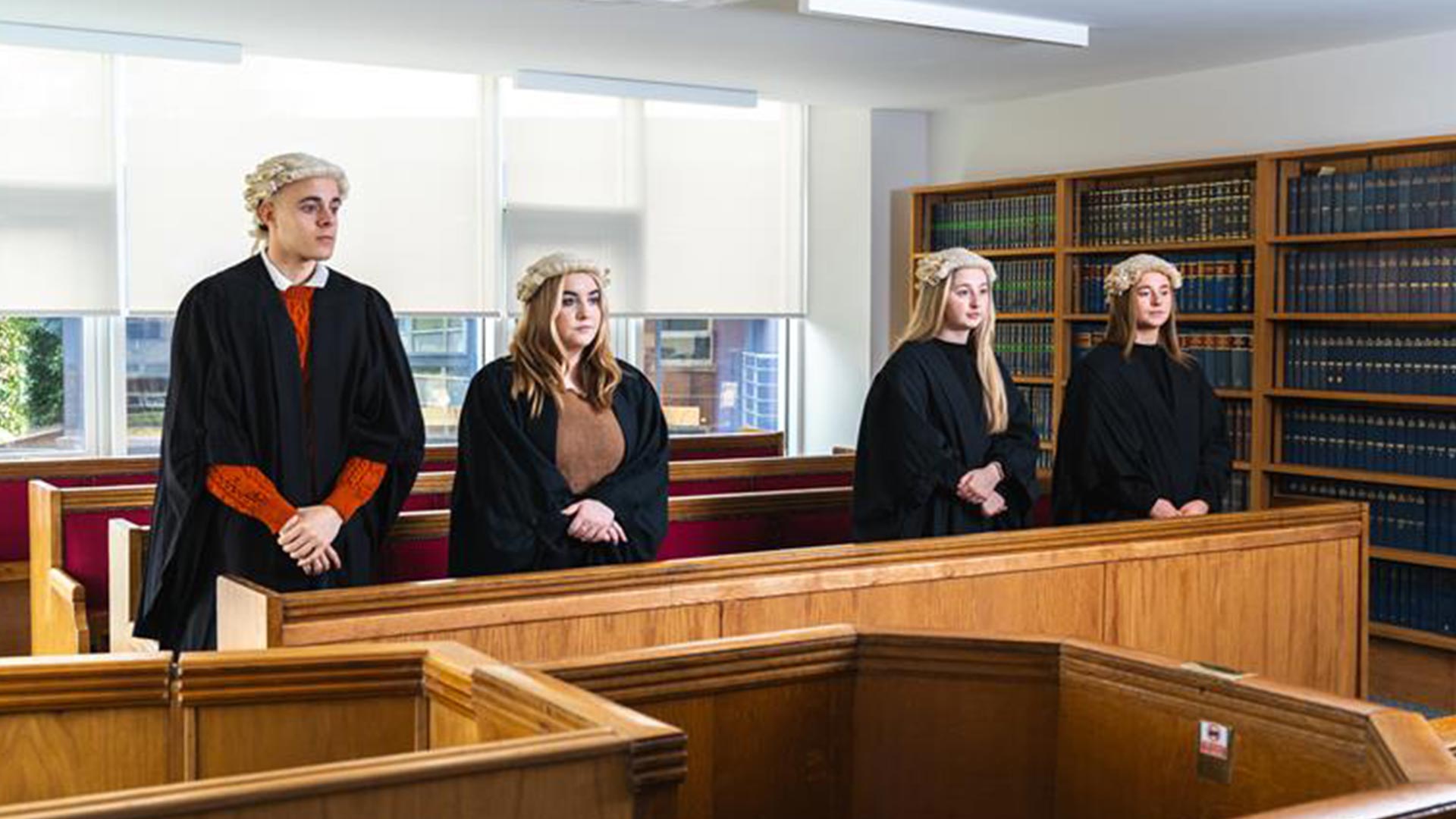 Students standing in the mock courtroom.