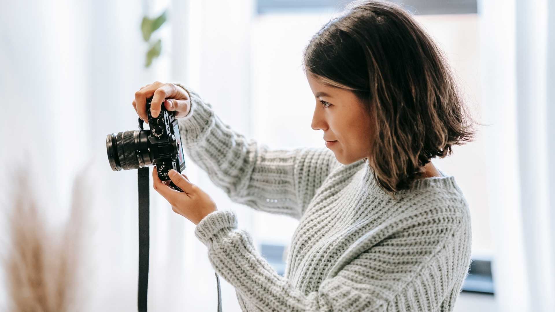 A woman holding a camera