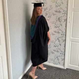 Amber in graduation robe
