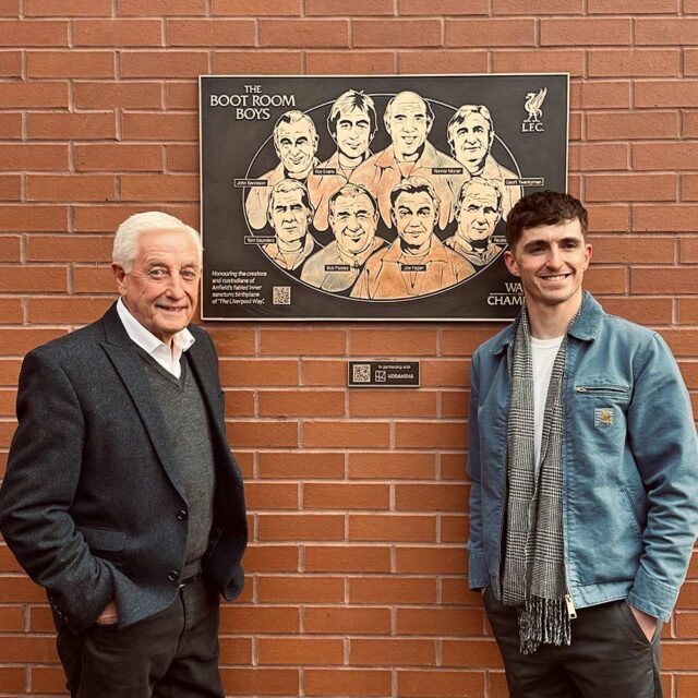 Darol with Roy Evans in front of a plaque
