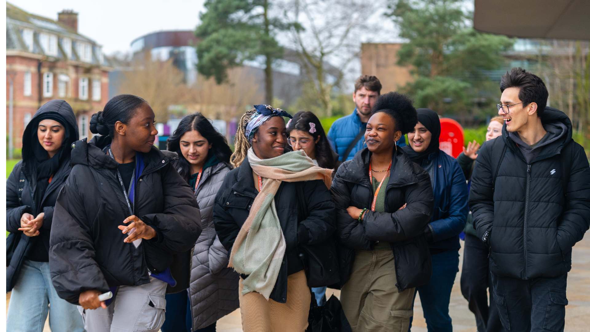 Group of students walking across campus