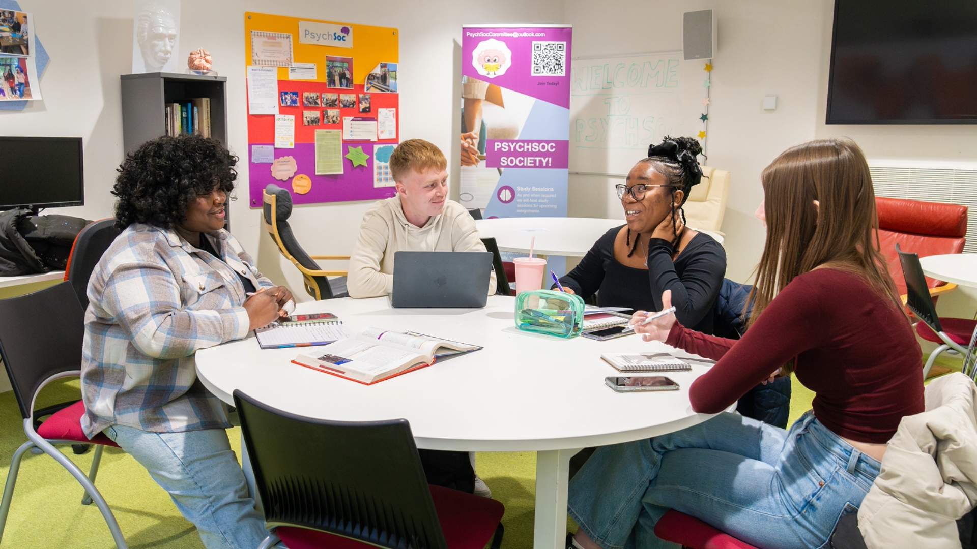 Students sitting round a table during a seminar