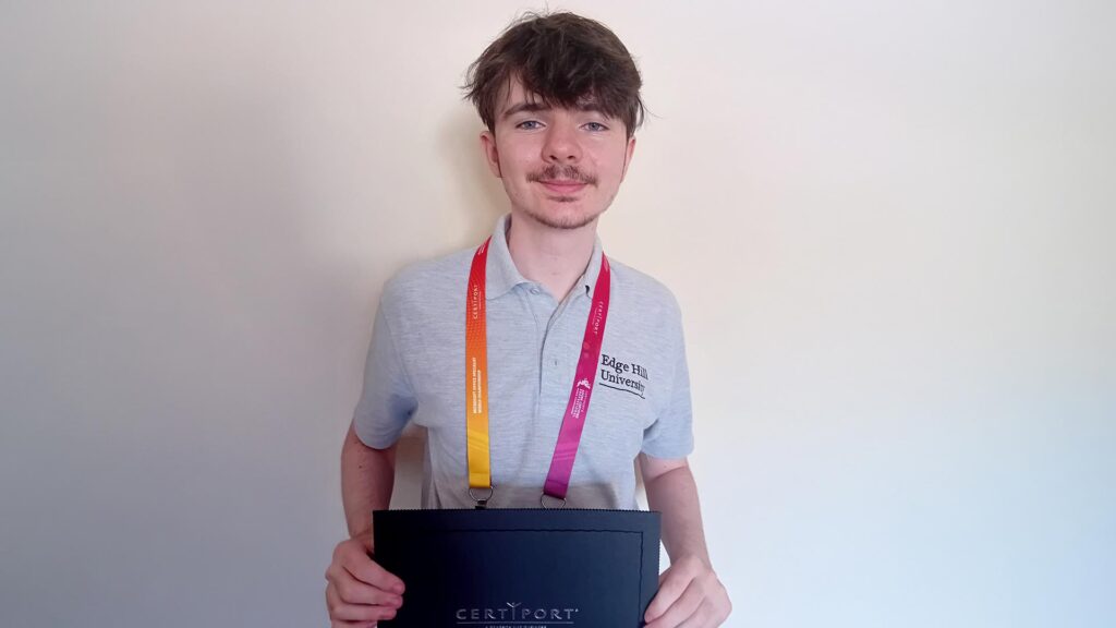 Photo of Thomas with his ceritficate - image provided by Thomas