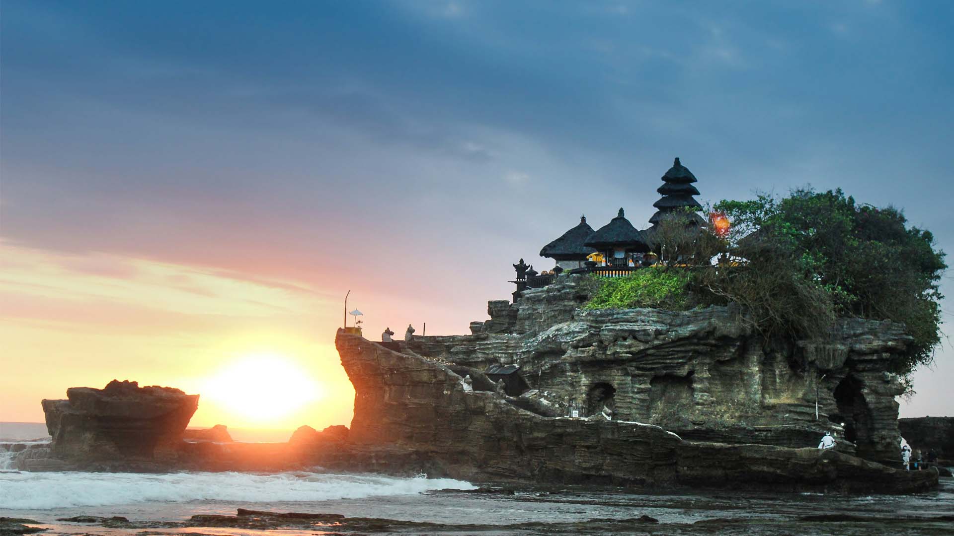 Buddhist temple at the top of a hill in the middle of the sea in Bali Indonesia