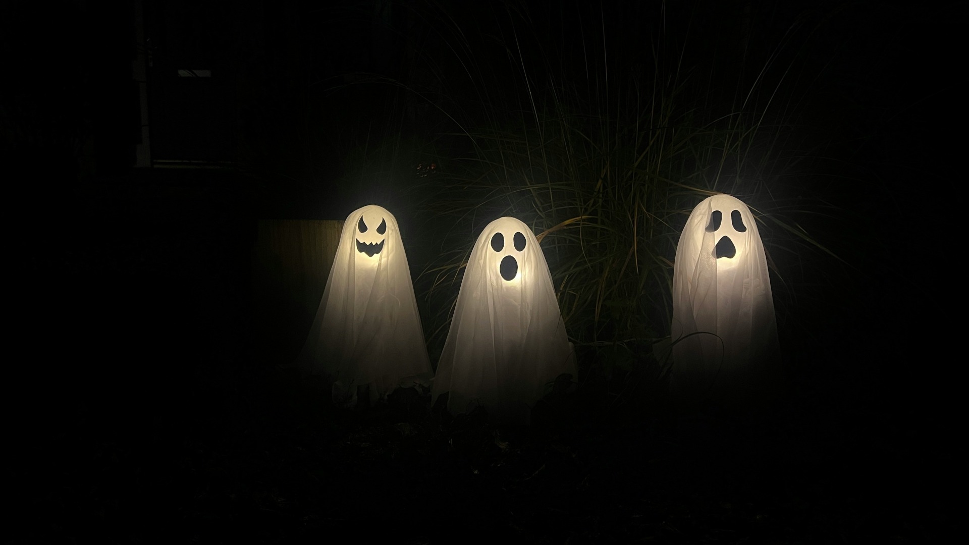 image of three lamp ghosts in the garden.