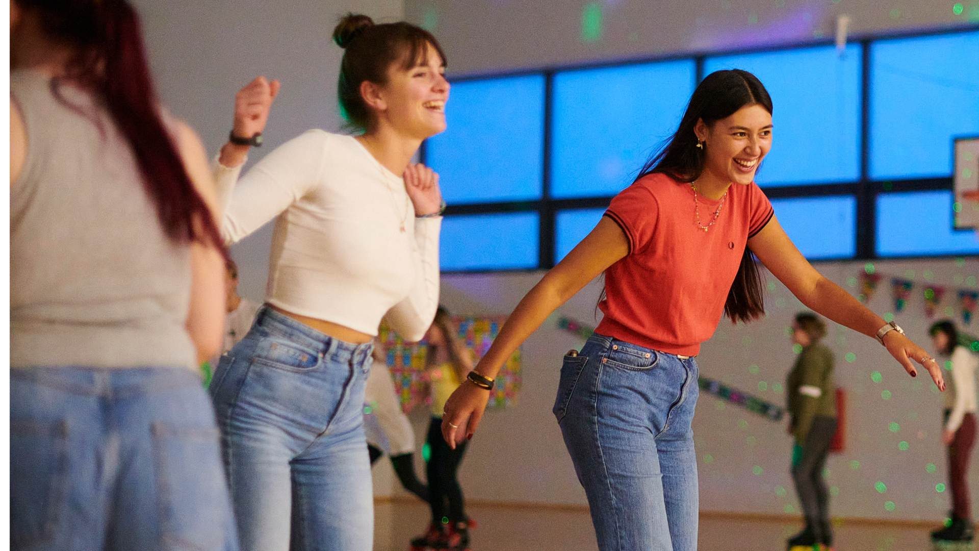 Student students roller skating and smiling