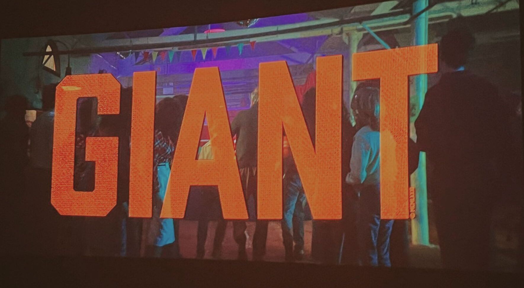 photo of cinema screen with title of film on - that says Giant